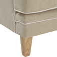 Close-up of Bondi Hamptons Sofa seat cushion with white piping, natural upholstery and tapered solid timber leg.