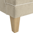 Close-up of Bondi Hamptons Sofa showing solid rubberwood leg, natural upholstery and white piping.