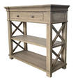 Angled view of the Bridgehampton Weathered Oak Console Table Small showcasing solid oak construction, brass handles and cross-braced side detailing.
