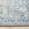 Detailed view of the Bridgeport Blue Runner showing its softly distressed blue and ivory traditional design.