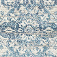Close-up of the Bridgeport Blue Runner medallion motif in deep blue, soft blue, ivory and neutral tones.