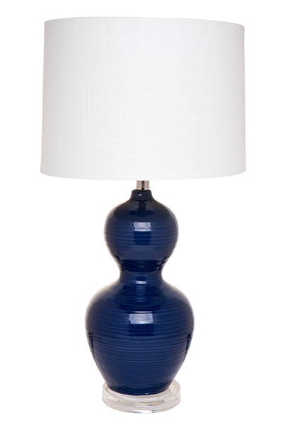 navy blue Bronte table lamp with ribbed ceramic base and white linen shade