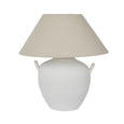 Camille white ceramic table lamp with fabric shade on bedside table creating warm ambient lighting