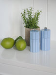 Capri denim wood salt and pepper grinders styled on white kitchen bench with greenery, coastal Hamptons decor