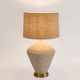 Textured white concrete table lamp base with natural linen shade detail