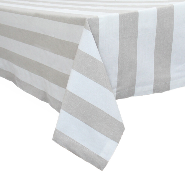 Chambray Natural Stripe cotton tablecloth with neutral coastal stripes draped over dining table