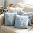 Palm Cove Cushion Chambray grouped with other soft neutral cushions