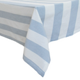 Chambray Stripe Blue Bold Stripe stonewashed cotton tablecloth featuring bold blue and white stripes draped over a dining table.
