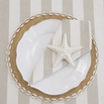 Chambray Stripe Napkin Natural styled with shell placemat, white scalloped plate, and white starfish for coastal table setting inspiration
