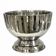 Polished stainless steel footed champagne bucket with fluted detailing, filled with champagne bottles — elegant design for stylish entertaining.