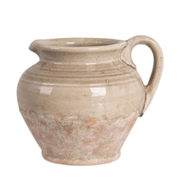 Rustic terracotta jug with weathered stone finish and artisan-inspired texture