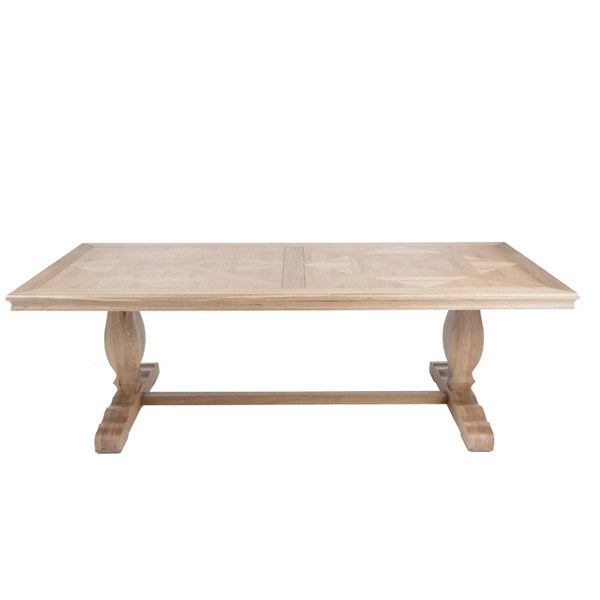 Charlotte 240cm dining table in natural oak with parquetry top, sculpted pedestal legs and trestle base.