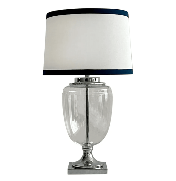 Charlotte glass and nickel table lamp with white linen shade and navy trim on neutral background