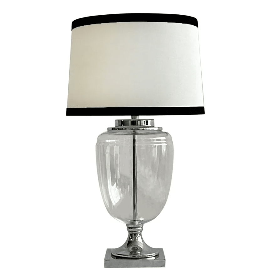 Charlotte glass and nickel table lamp with white linen shade and black trim in Hamptons style interior
