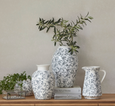 Grey and white chinoiserie porcelain vase displayed with coordinating décor in a classic provincial interior