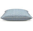 Reversible cushion showing cadet blue patterned fabric with ticking stripe reverse