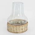 Coastal glass hurricane lantern with natural woven wicker base for relaxed home styling