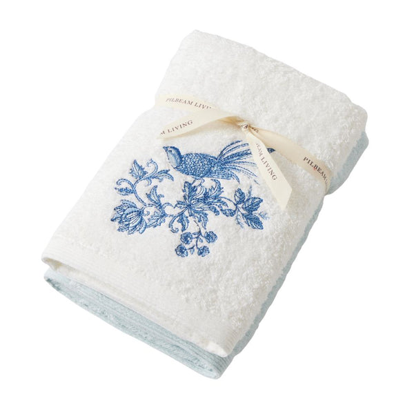 Chinoiserie Hand Towel Set of 2 featuring one plain white towel and one embroidered towel with a blue bird and floral design.
