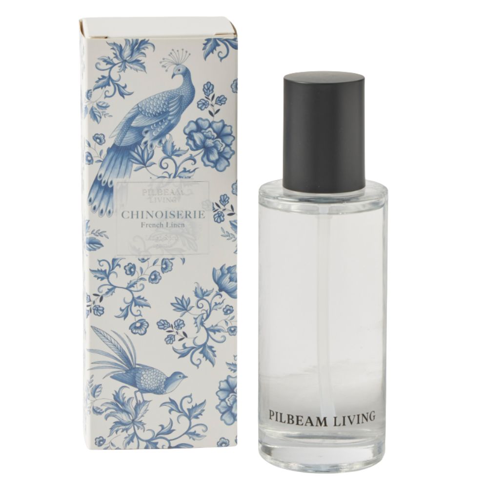 Chinoiserie French Linen scented linen spray in clear bottle with black cap beside blue and white floral patterned gift box.