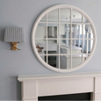 Chloe White Paned Round Mirror styled above a white mantel in a Hamptons-inspired interior, reflecting a bright coastal kitchen and enhancing light, depth, and architectural character.