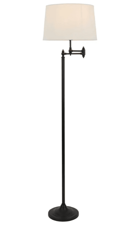 Classic aged brass floor lamp with adjustable swing arm lighting detail