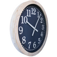 Angled view of Clock Manhattan 60cm with navy face, white numerals and natural timber-look frame