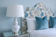 Textured ceramic table lamp base with elegant metal detailing and white linen shade
