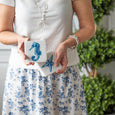 Blue and white coastal coasters featuring seahorse and starfish motifs, designed for relaxed coastal and Hamptons entertaining.