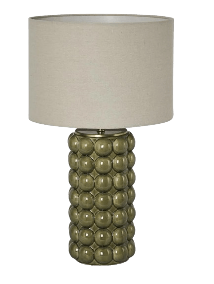 Condetti green ceramic table lamp with textured sculptural base and linen shade styled in a coastal living room