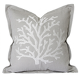 Natural cotton cushion with white embroidered coral design in a coastal Hamptons style