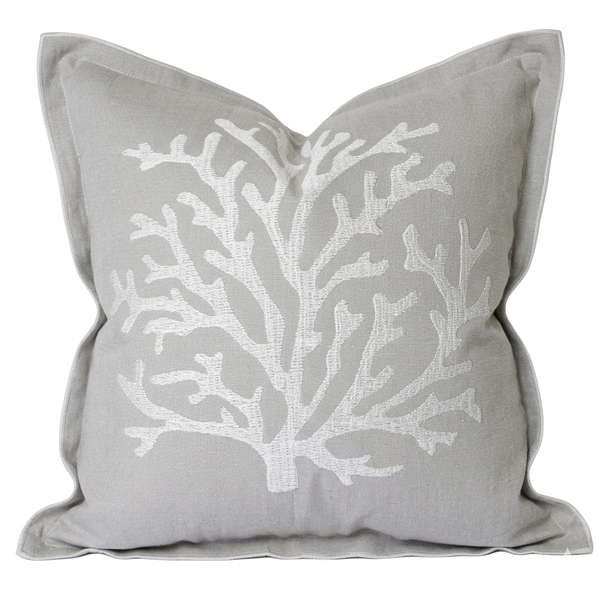 Natural cotton cushion with white embroidered coral design in a coastal Hamptons style