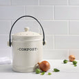 Darley Stoneware Compost Bin styled on a kitchen benchtop with fresh vegetables and neutral decor