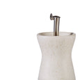 Close-up detail of cream speckled stoneware oil bottle with stainless steel pourer