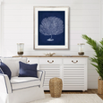 Curious Coral Delight X Designer Boys navy coral artwork styled above a white sideboard in a classic Hamptons coastal living room.
