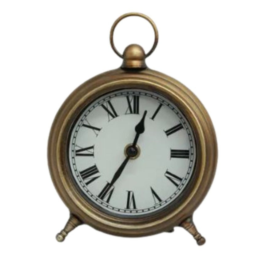 Antique gold desk clock with a white face displaying Roman numerals, a gold frame, and a small ring at the top for hanging.