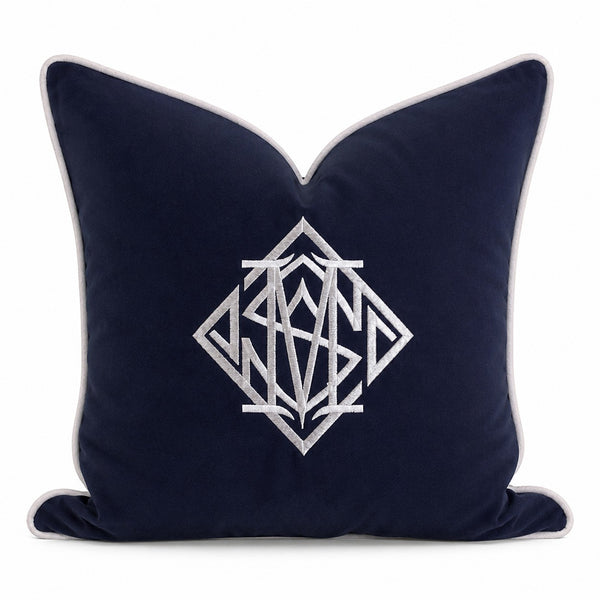 navy cushion cover with white embroidered diamond monogram and piped edge, classic coastal styling