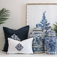 navy monogram cushion styled with blue and white ginger jars and coastal decor on console