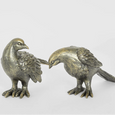 Pair of Dove Lovebird sculptures in antique brass and copper finish with detailed feathers and complementary poses.