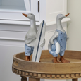 Ducks Surfing Large Set/2 decorative coastal duck figures styled on a round oak side table, featuring a surfboard and lifebuoy, bringing playful beach house charm to a Hamptons-inspired interior.