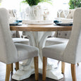 Eastport linen dining chairs styled with a round timber and white pedestal dining table