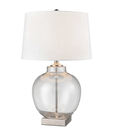 close-up of Ellyn lamp showing round clear glass base and brass nickel-finished detailing