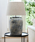Close-up of Emilia textured terracotta lamp base in aged grey finish
