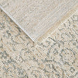Veil Blue Rug close-up showing patterned polyester pile, edge finish and backing