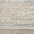 Close-up of Emma Blomfield Veil Blue Rug showing distressed pattern, pile and fringe detail
