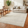 Emma Blomfield Veil Blue Rug styled beneath a neutral sofa in an elegant living room