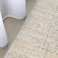Emma Blomfield Veil Blue Rug styled with white linen curtains in a soft neutral interior