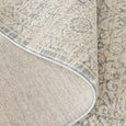 Folded Emma Blomfield Veil Blue Rug showing soft 8mm pile and bound edge