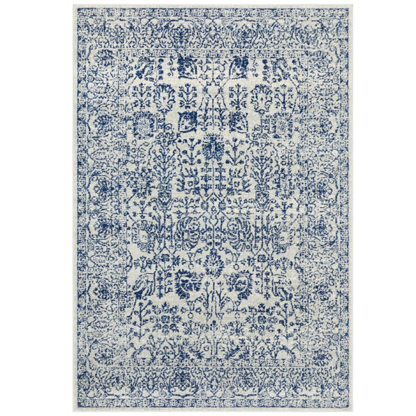 Eve Blue Rug featuring distressed botanical pattern in azure blue and ivory tones