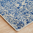 Close-up of Eve Blue Runner showing distressed azure blue floral and vine pattern