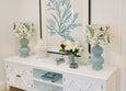Handmade floral lampshade styled in a Hamptons-inspired living room creating warm ambient lighting